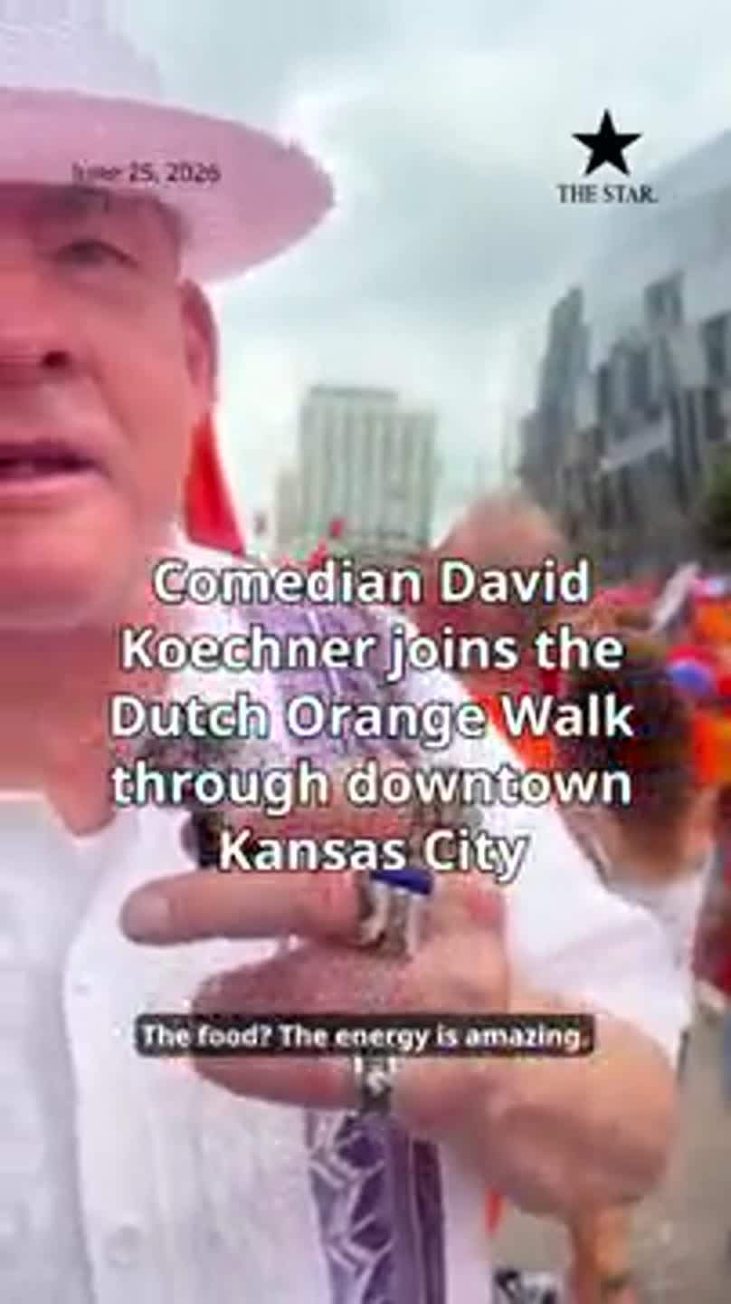 Comedian David Koechner joins the Dutch Orange Walk through downtown Kansas City