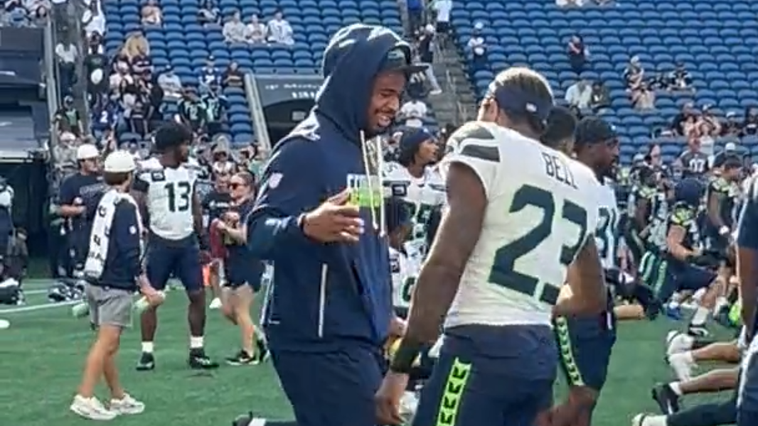 Nick Emmanwori stretching some with teammates at Seahawks' annual fan fest at Lumen Field