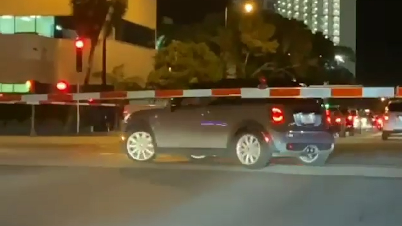 Watch a car on the tracks as a Brightline train approaches. Then, the driver made a move