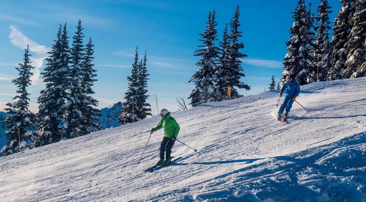 Clear skies and fresh powder draws eager skiers to Crystal Mountain Resort