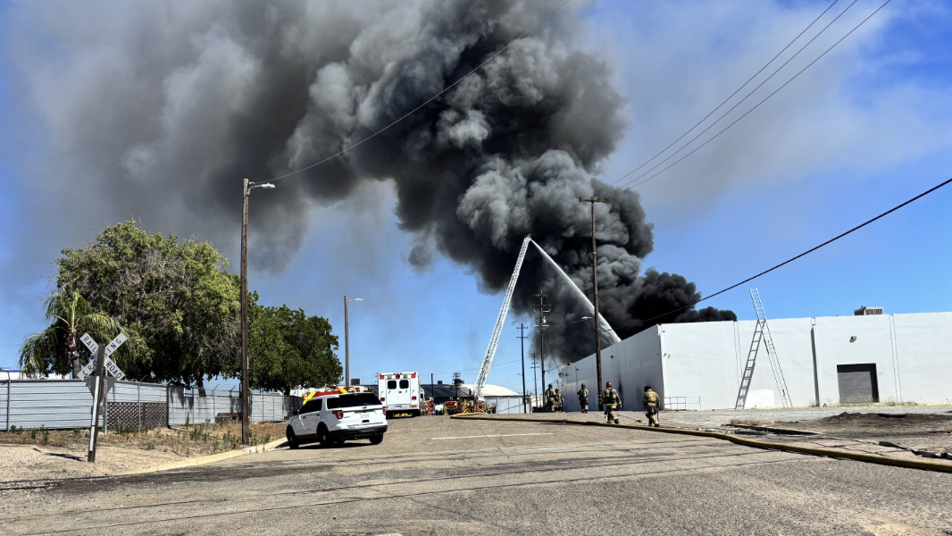 Fire crews battle a large warehouse blaze near downtown Fresno