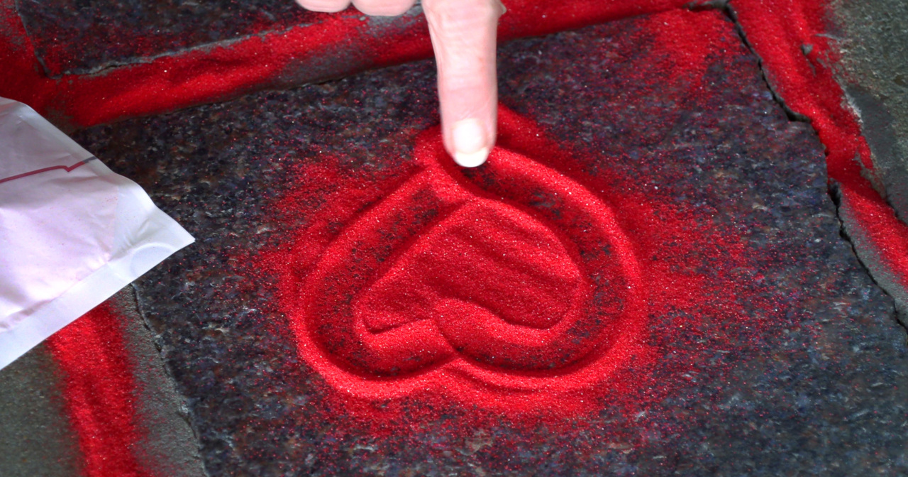 Have you seen red sand in sidewalk cracks? If so, here’s why.