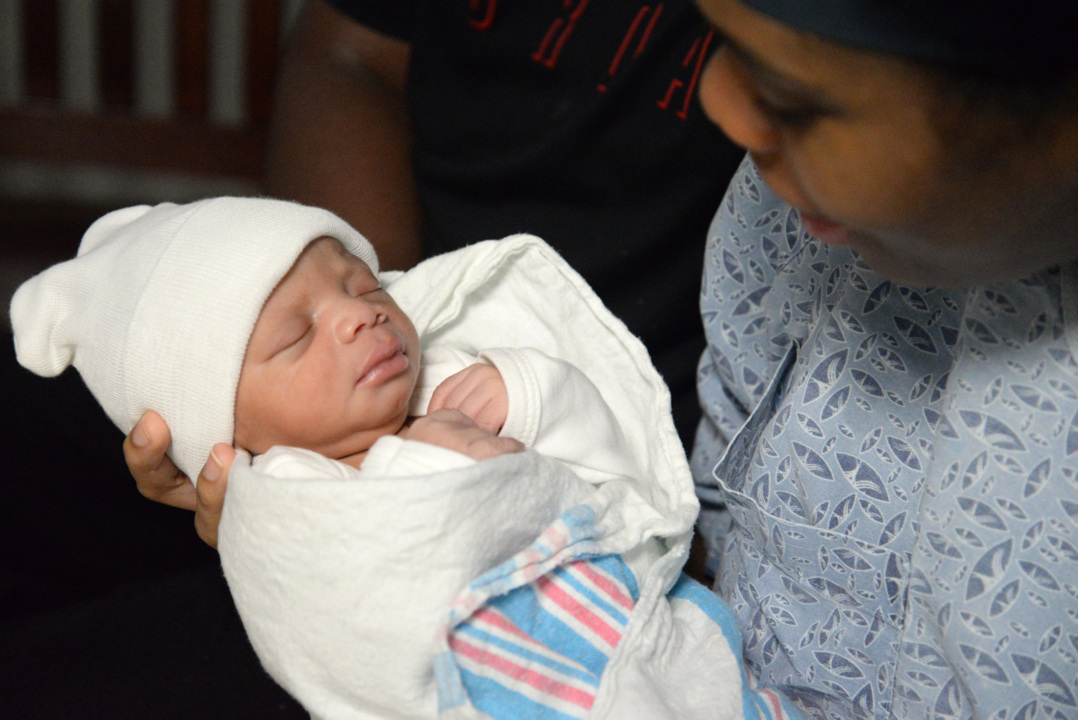 She was trying to sleep while Hurricane Michael roared outside. Then her water broke