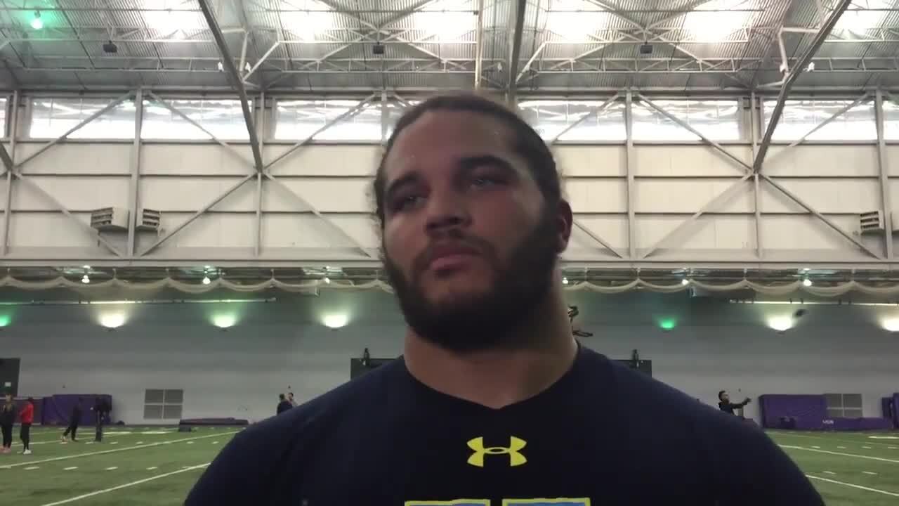 Huskies defensive lineman Elijah Qualls talks at UW Pro Day