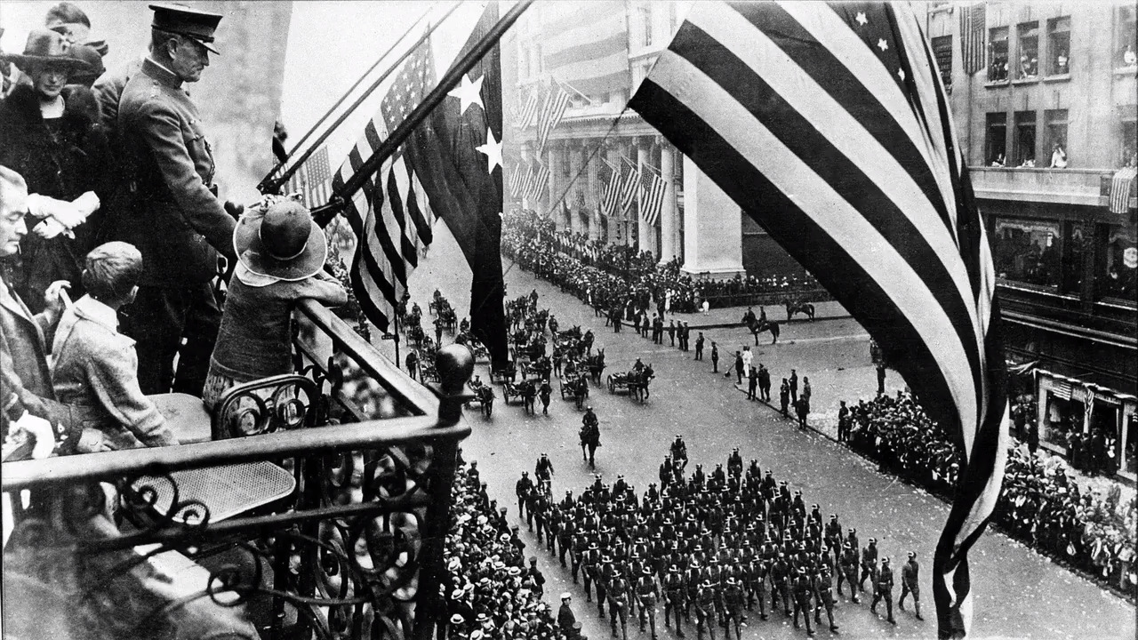 Why do people wear poppies to remember WWI on Veterans Day?