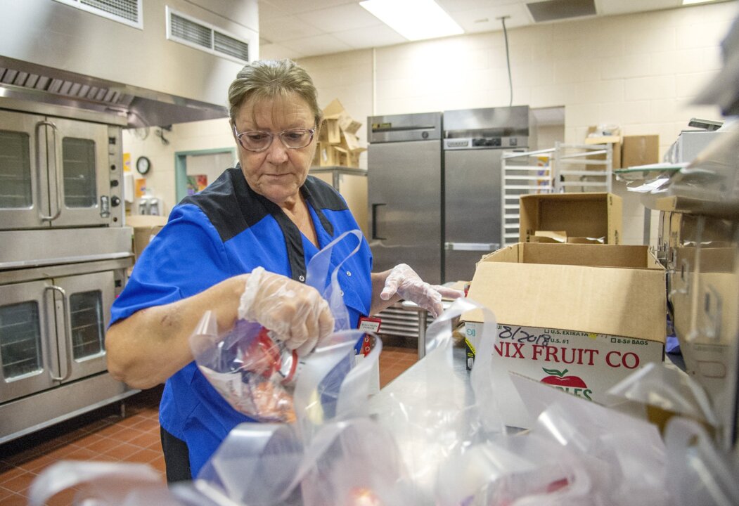 Now serving: Locally grown peaches and hydroponic lettuce on the school lunch line
