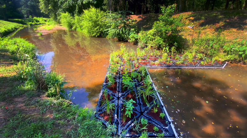 Watch installation of first-ever floating wetland trash trap in Columbus park