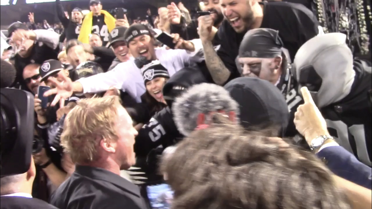 Jon Gruden celebrates with Raiders fans in the ‘Black Hole’