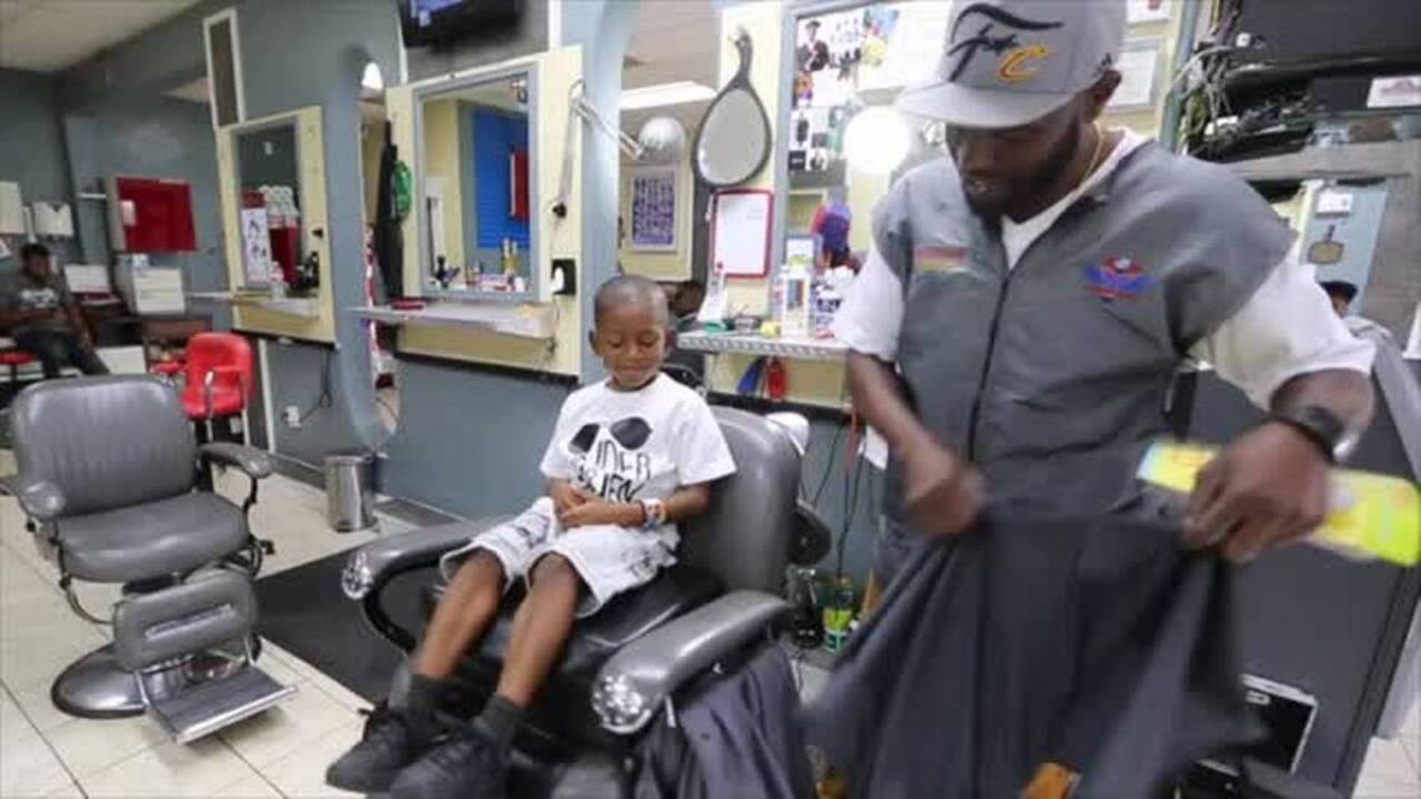 Buzz cuts and books: Kids learn in a stylish setting in the Reading With Barbers program