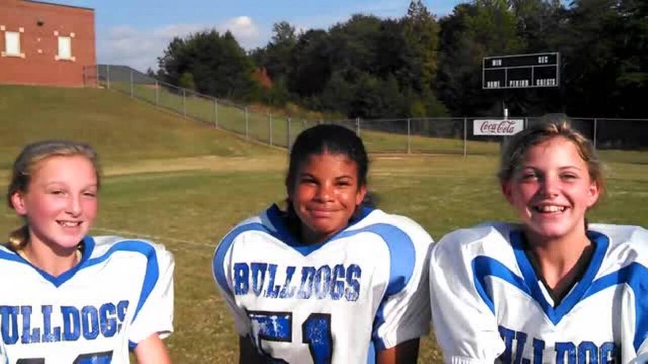 3 girls on school football team looking to win