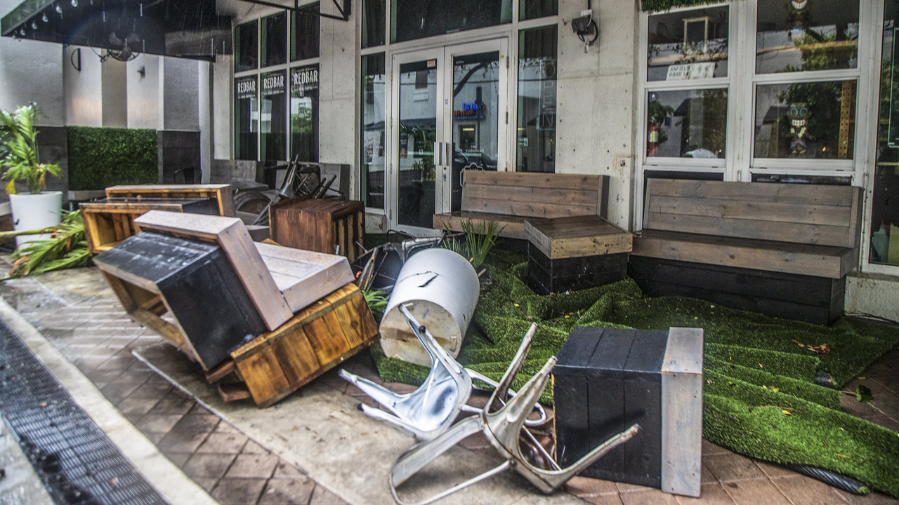 Brickell stores clean up after heavy rainfall floods area