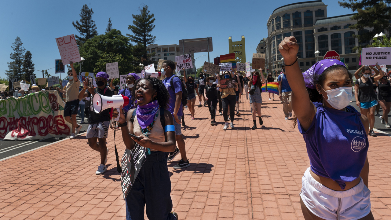 See July 4th youth march calling for Black freedom cross Tower Bridge in Sacramento