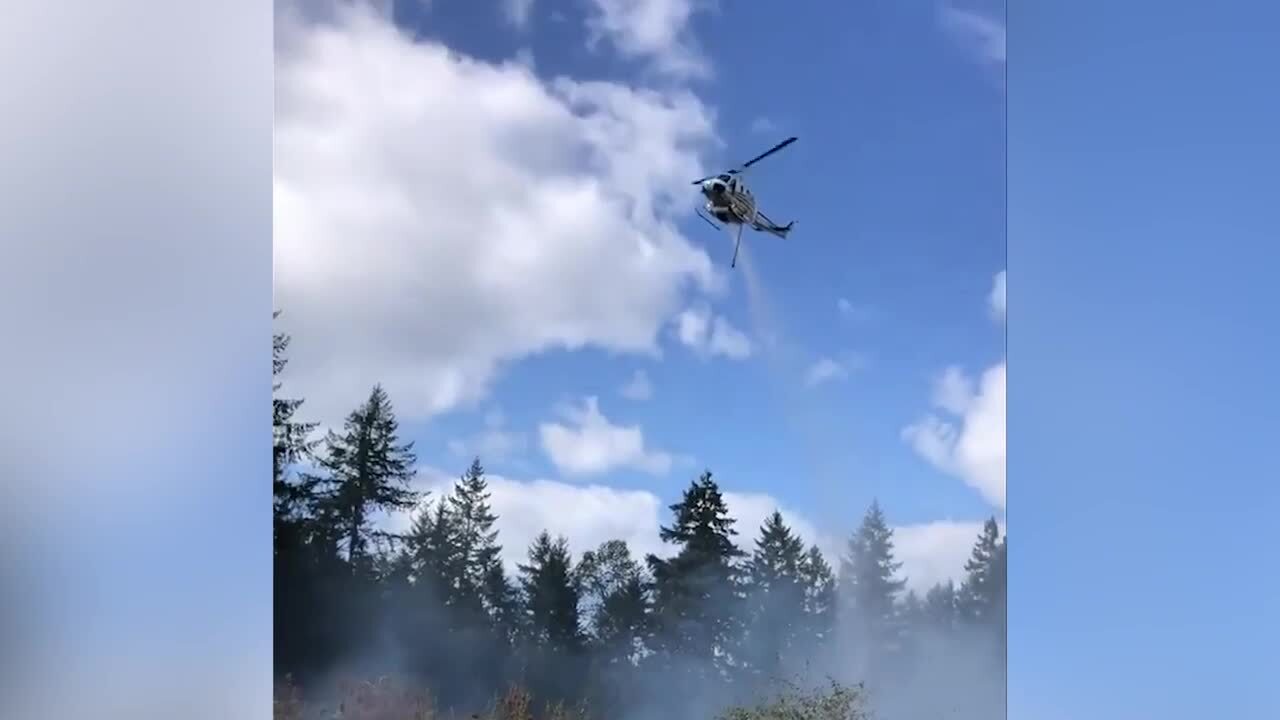 Sunday brush fire in Hawks Prairie was contained with help of helicopter