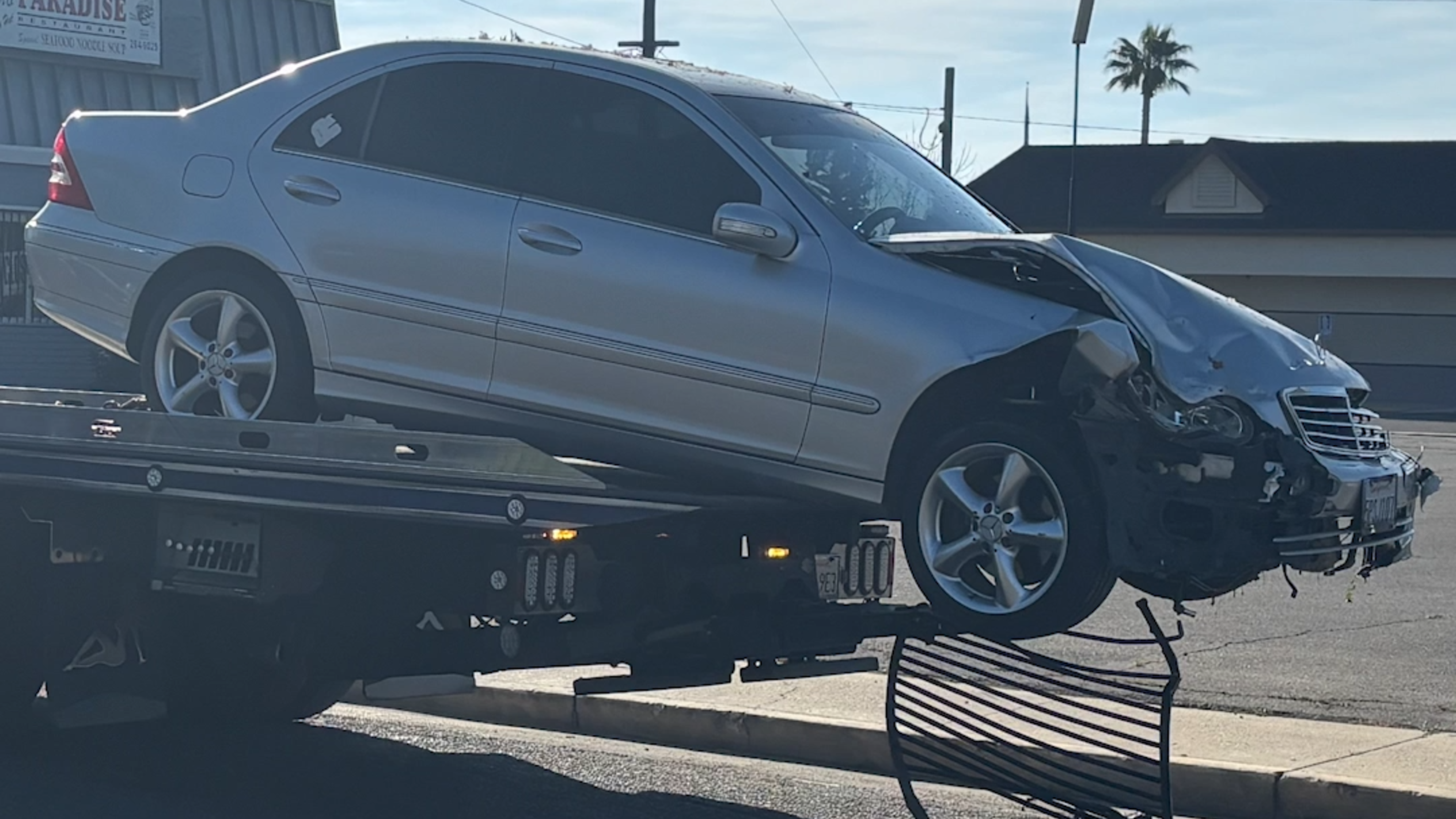 Three-vehicle crash results in car nearly striking Fresno apartment