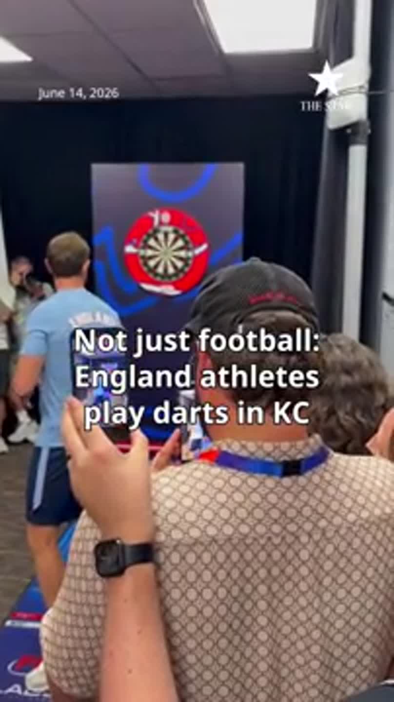 England players try their hand at darts in break from training in KC