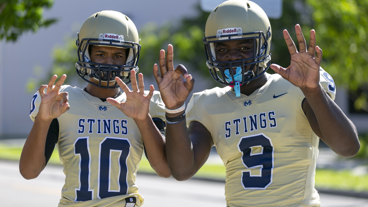 Miami Dolphins donate football equipment, cleats and new uniforms to Miami Senior High School
