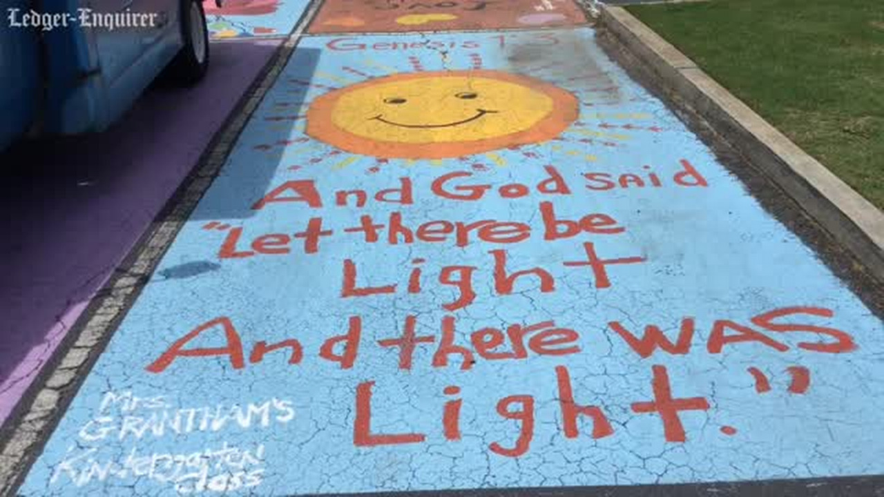 St. Luke students bring God’s holy word to parking lot