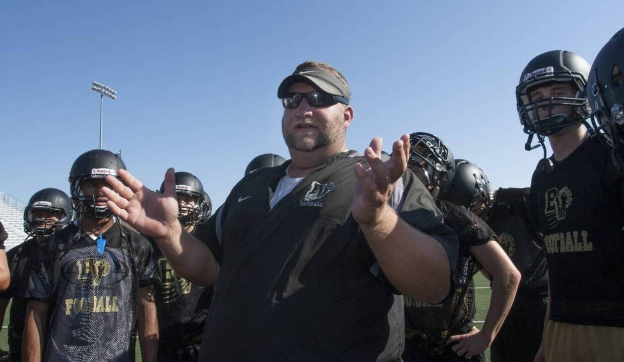 Blue Valley football coach Eric Driskell on life support