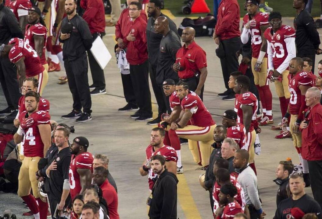 Seattle, S.F. high school football teams kneel during national anthem