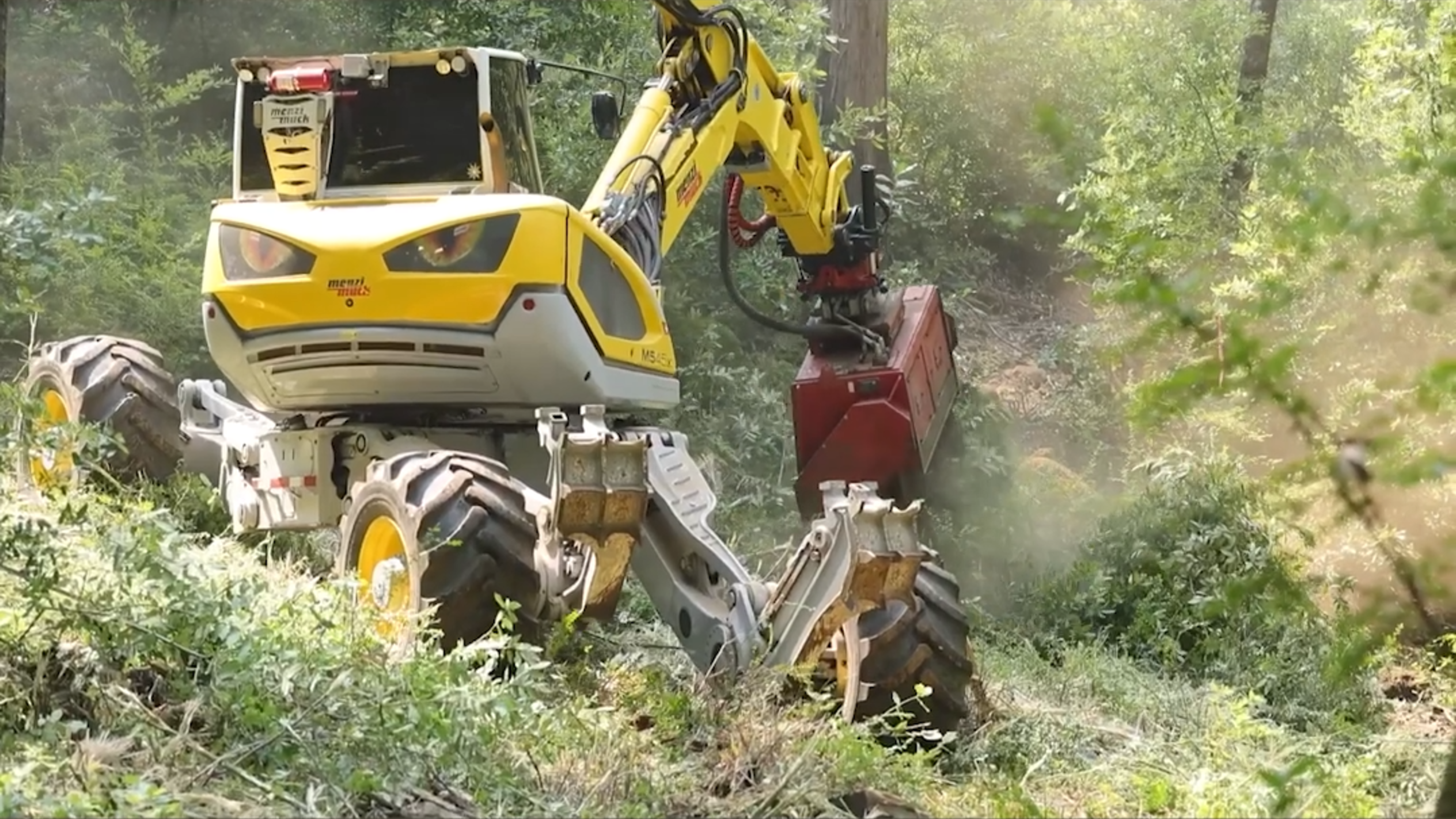 Excavator clears vegetation to help fight Timber Fire