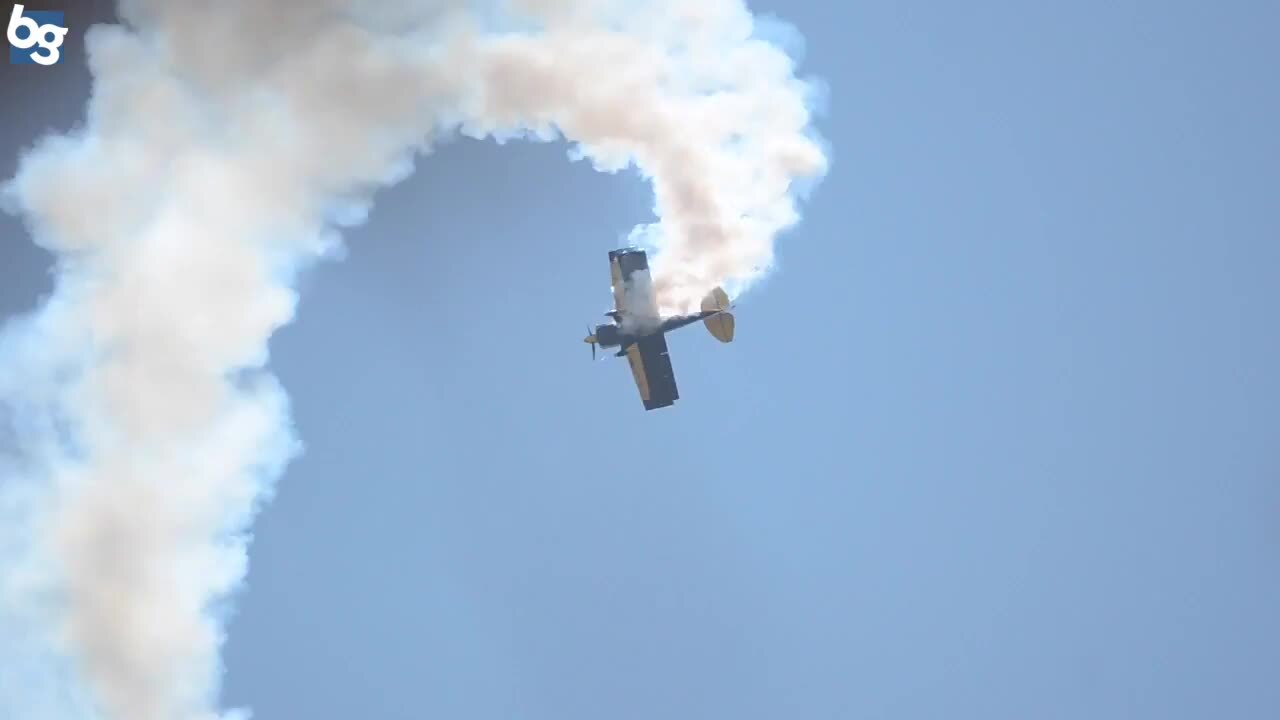 Stunt pilot does free falling spirals during Air Show