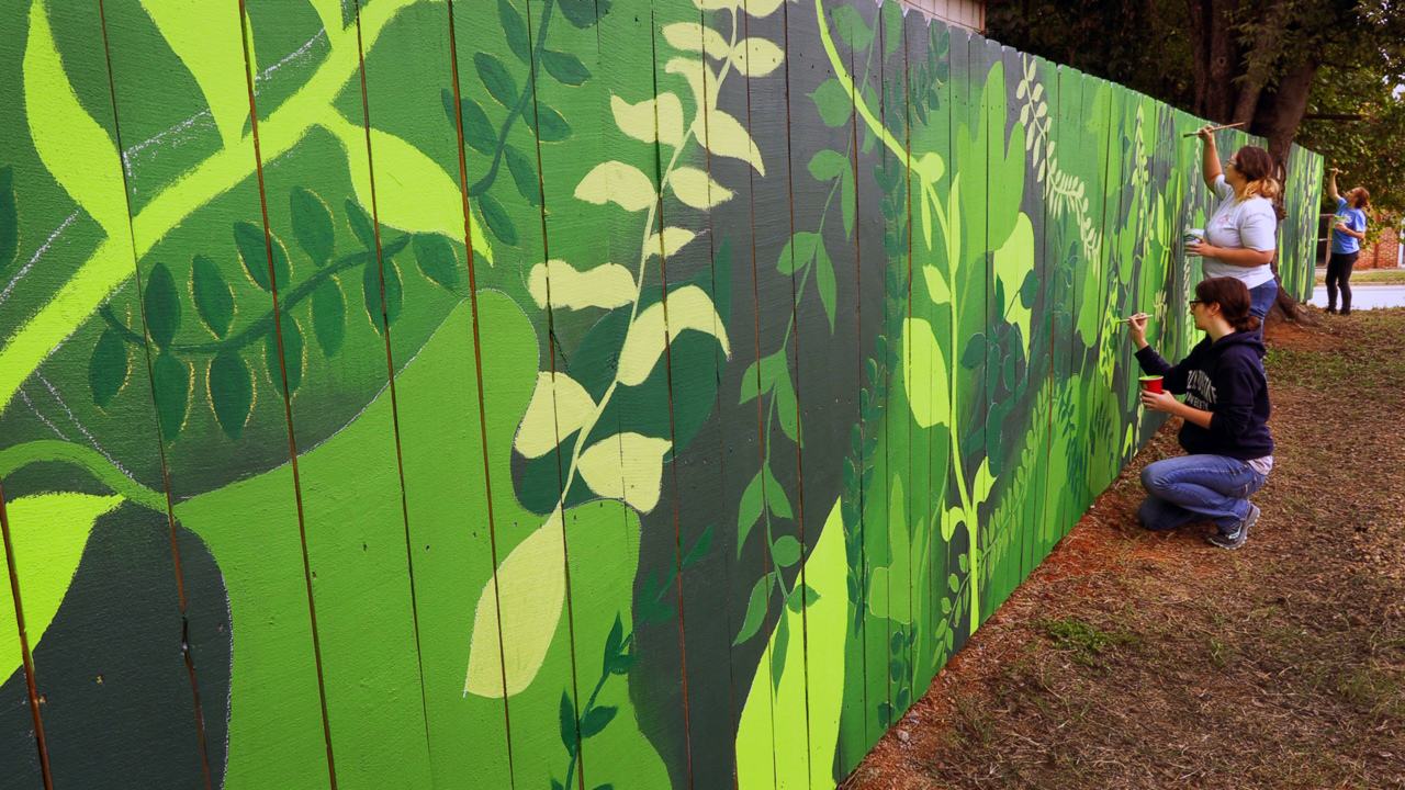 New mural in Columbus  brightens community orchard in ‘The Bibb’