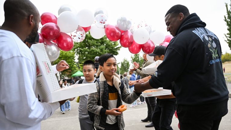Balloons, high fives and Krispy Kreme: Students head to 1st day of class at Tacoma school