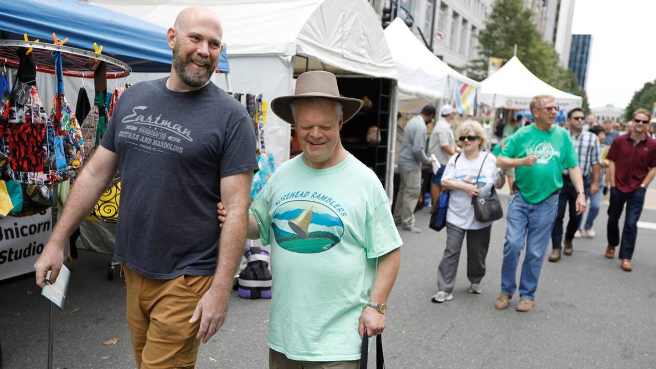 When the bluegrass festival comes to Raleigh, guides are needed to help the visually impaired