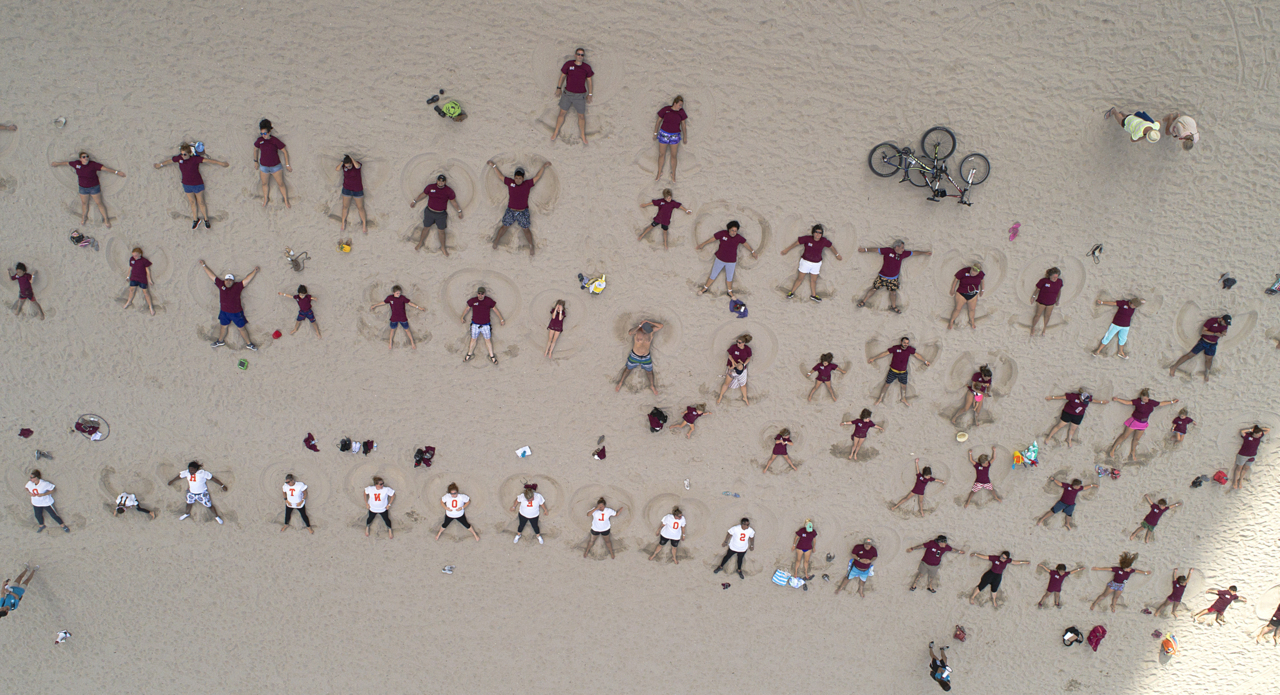 Watch Florida residents, visitors try to break world record for making sand angels