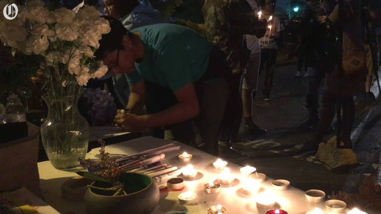 Singing, praying and petition signing at Keith Lamont Scott candlelight vigil
