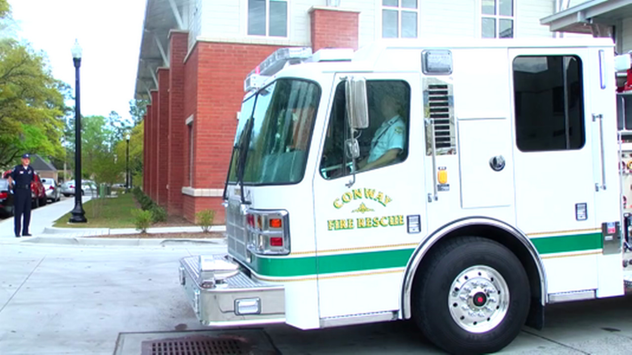Conway wets down brand-new fire engine in ceremony and pushes truck into new home