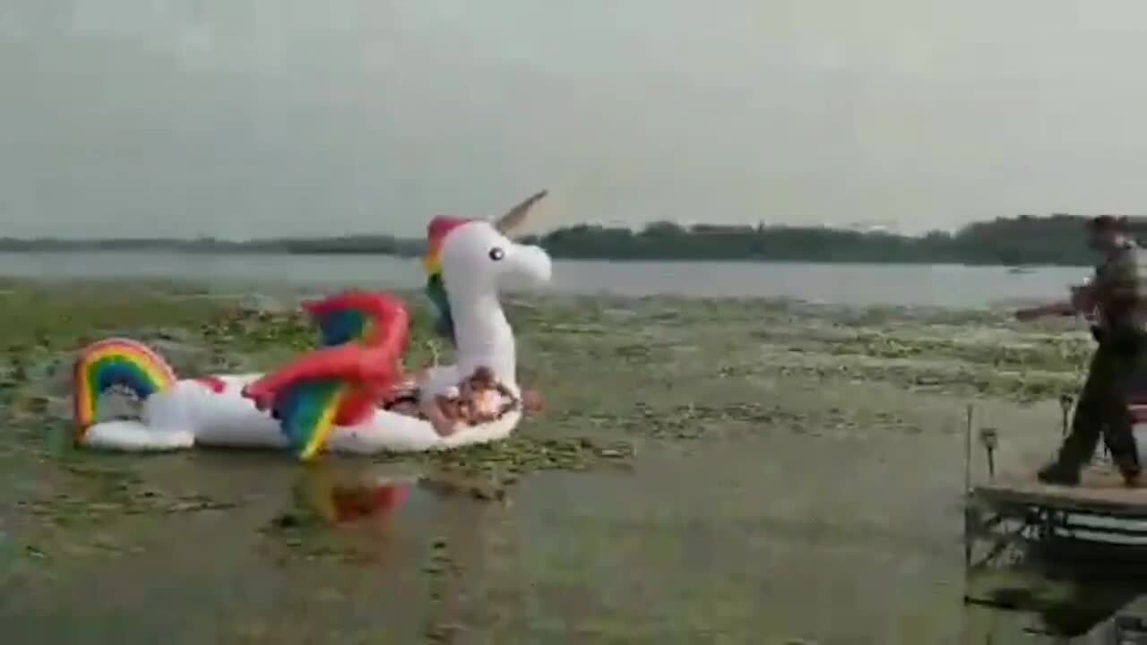 Women on inflatable rainbow unicorn rescued from weedy Minnesota lake