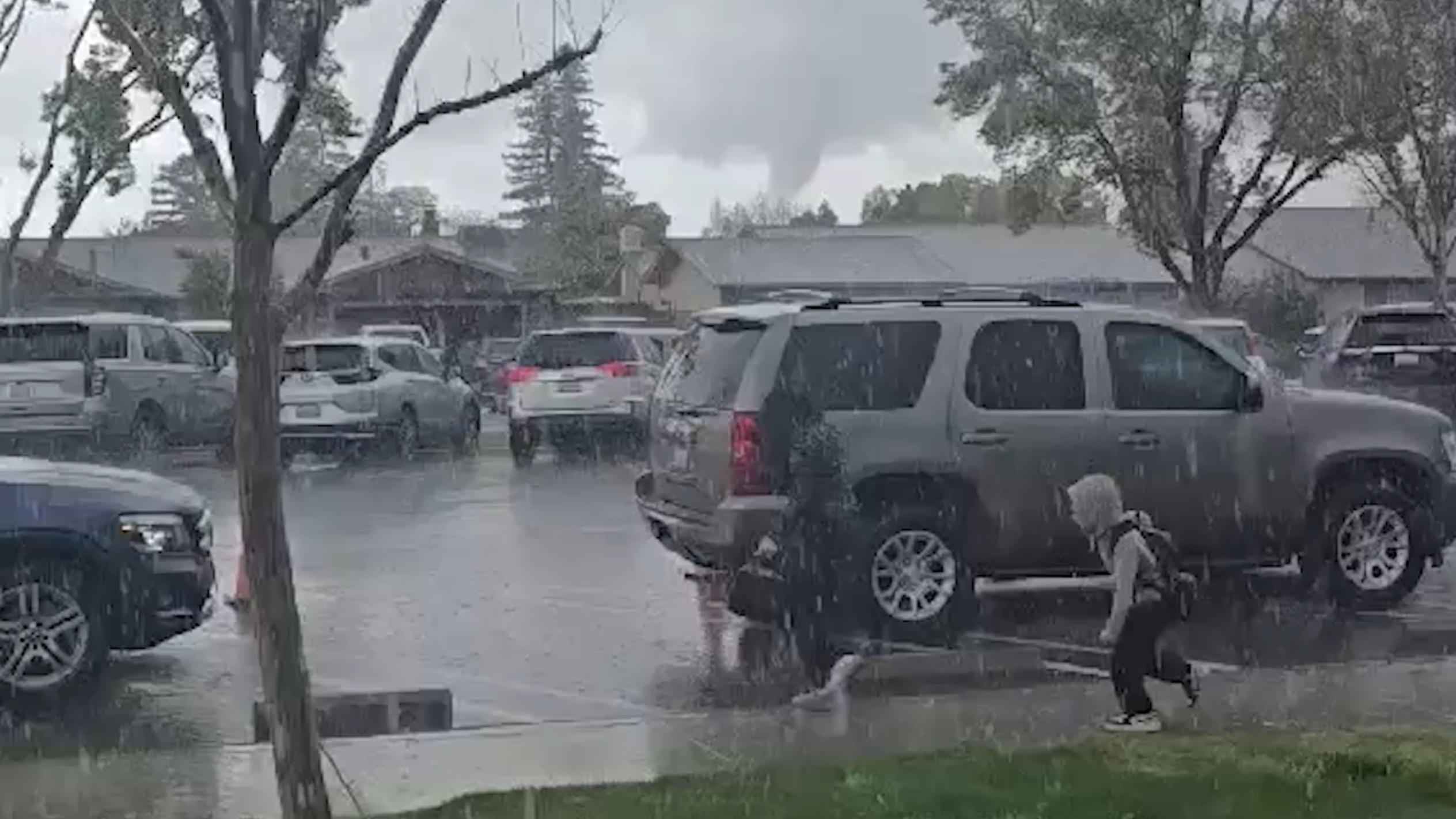 Two-minute twister tears a nearly mile-long path just outside of Modesto