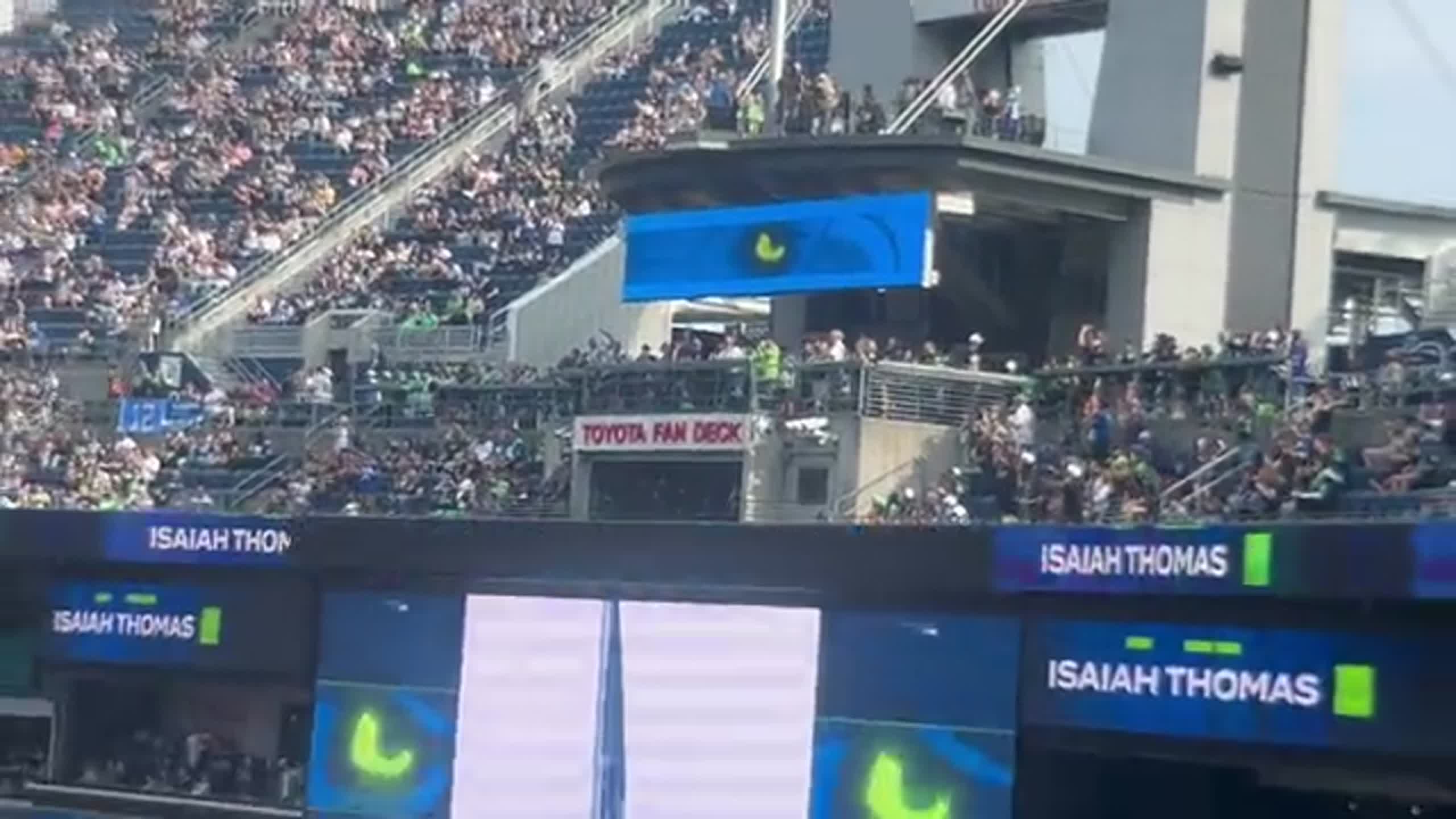 Tacoma's Isaiah Thomas raises 12 flag before Seahawks' preseason game vs Dallas