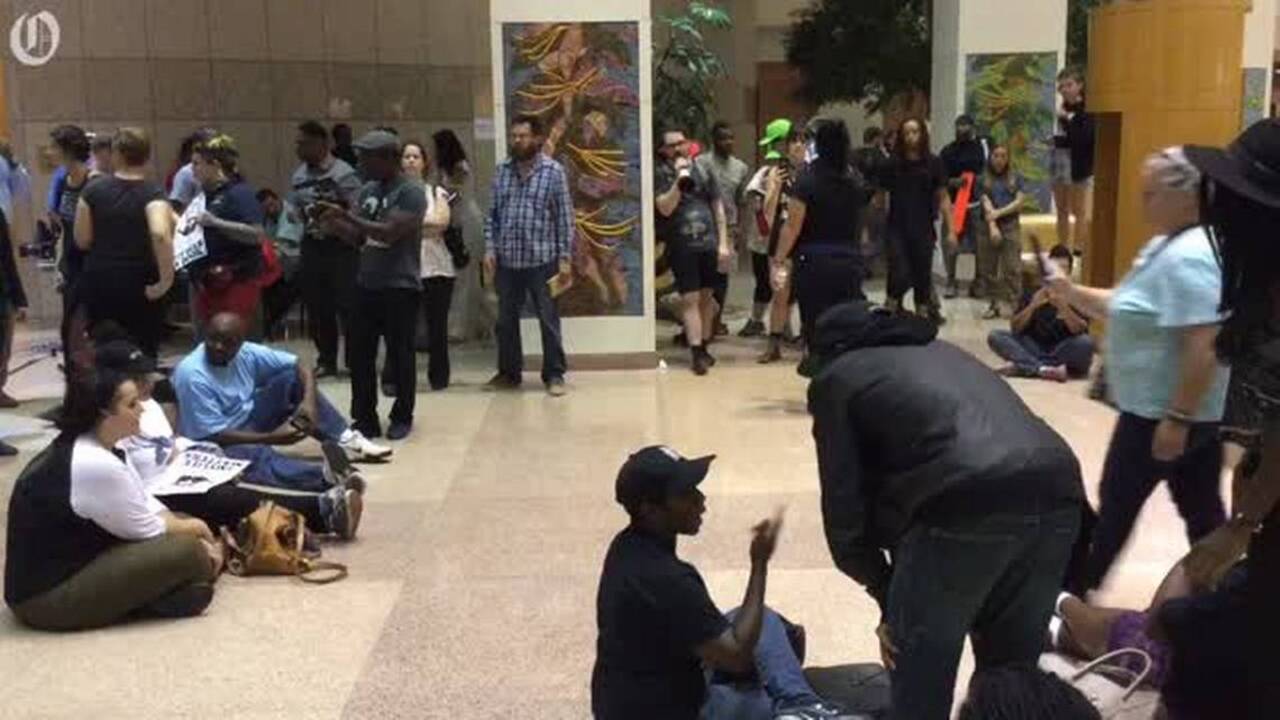 Protesters chant inside Government Center
