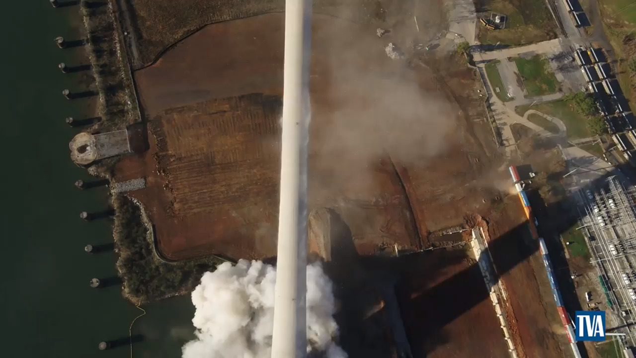 1,000 foot smoke stack implodes, topples into Alabama field