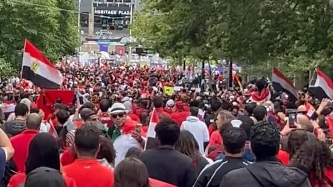 Egypt fans through Pioneer Square on way in to Seattle World Cup match vs Iran