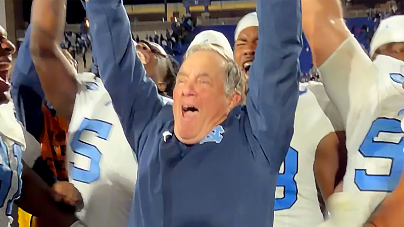 UNC and Bill Belichick celebrate with Victory Bell after dramatic win over Duke