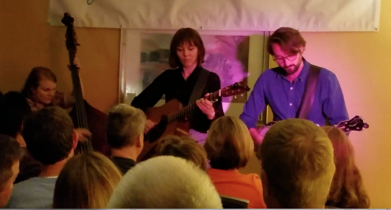 Molly Tuttle and her band jam at IBMA