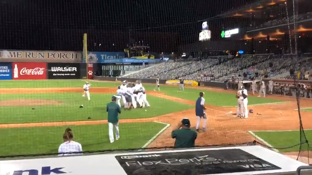 Pitcher rushes to console losing friend after striking him out for championship win