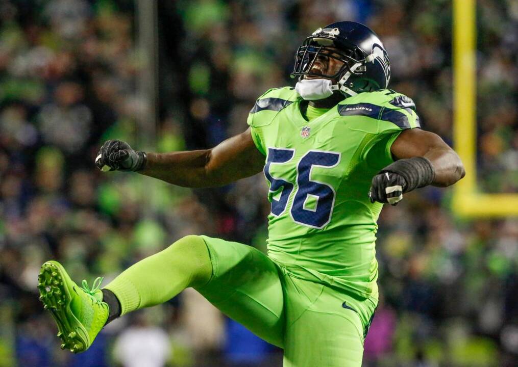 DE Cliff Avril after 1 1/2 sacks help Seahawks win NFC West