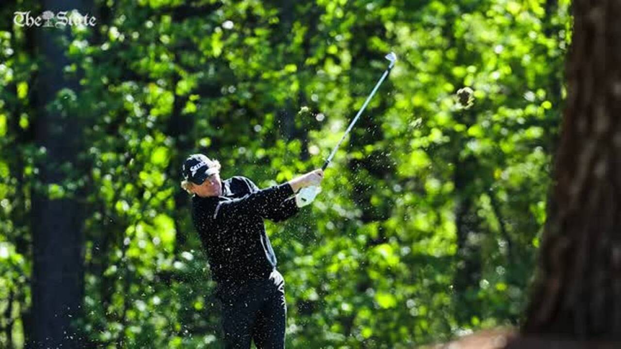 Henley fights his way through Masters second round