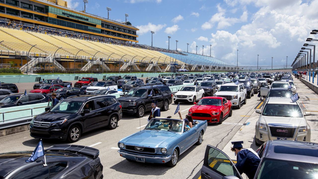 Columbus High graduates cross the finish line at Miami-Homestead Speedway