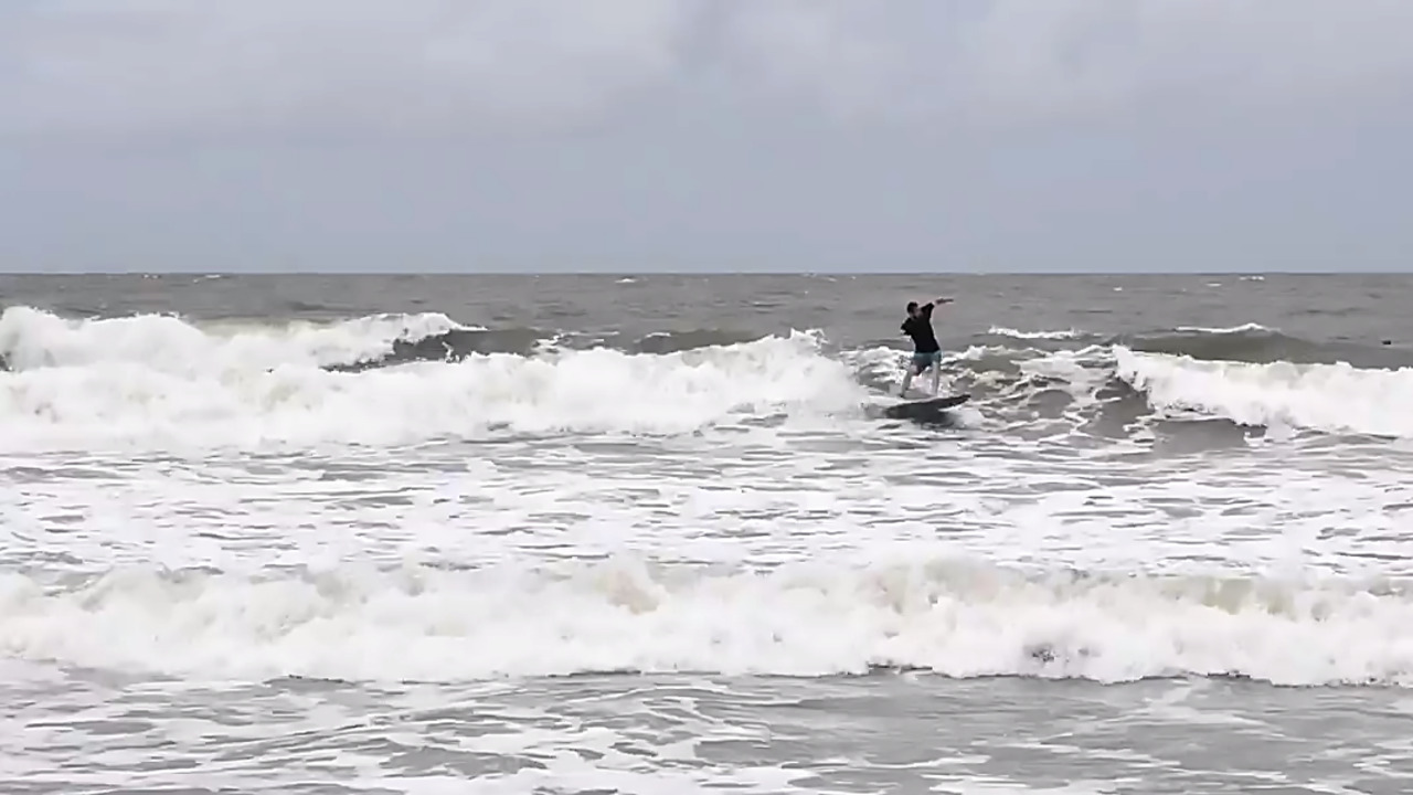 Surfers catch the waves at Myrtle Beach as Dorian approaches
