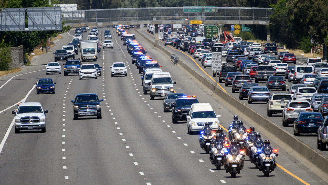 Officers salute Tara O’Sullivan during funeral procession from Sacramento to Elk Grove