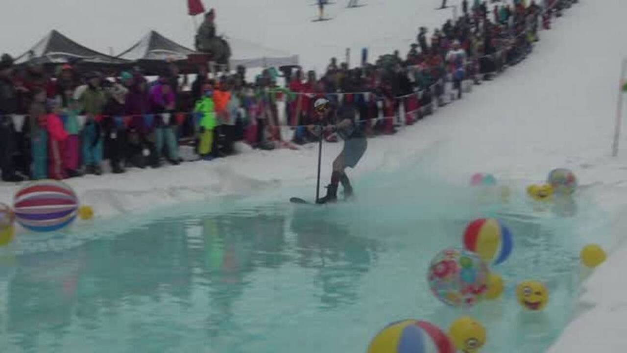 At Brundage, competitors try to skim across pond on snowboards, ski bikes and, yes, a three-person ski