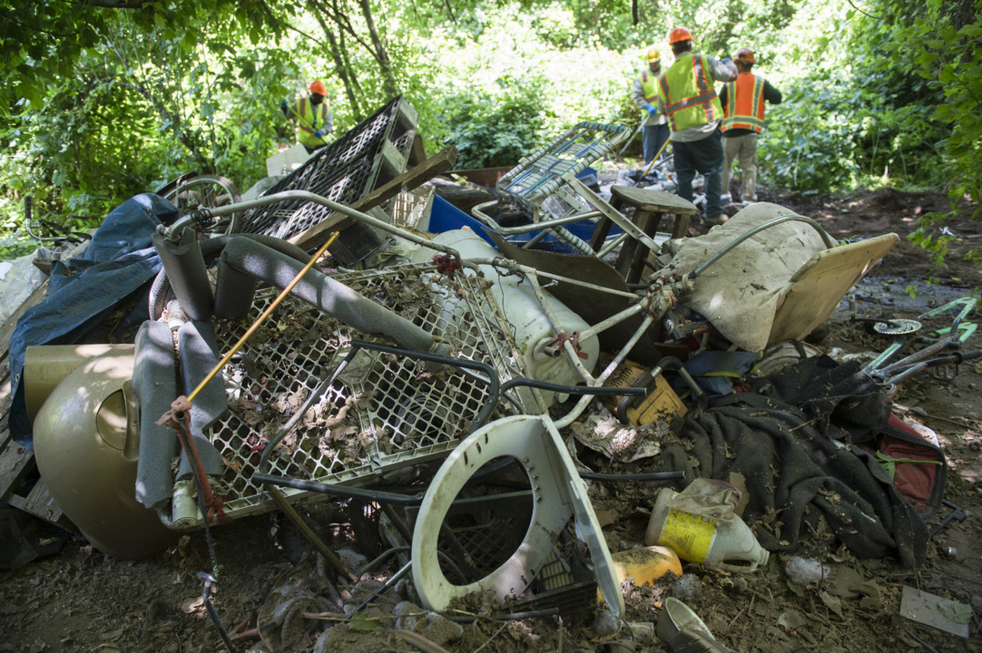 Watch county crews clean up one homeless man’s vast Parkway horde