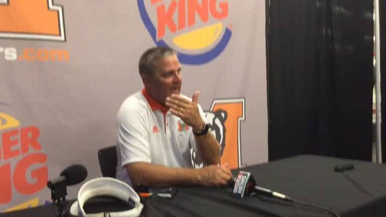 Bears overcome adversity, strange official's call for win