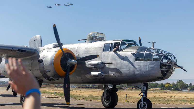 Vintage military aircraft fly over Nampa
