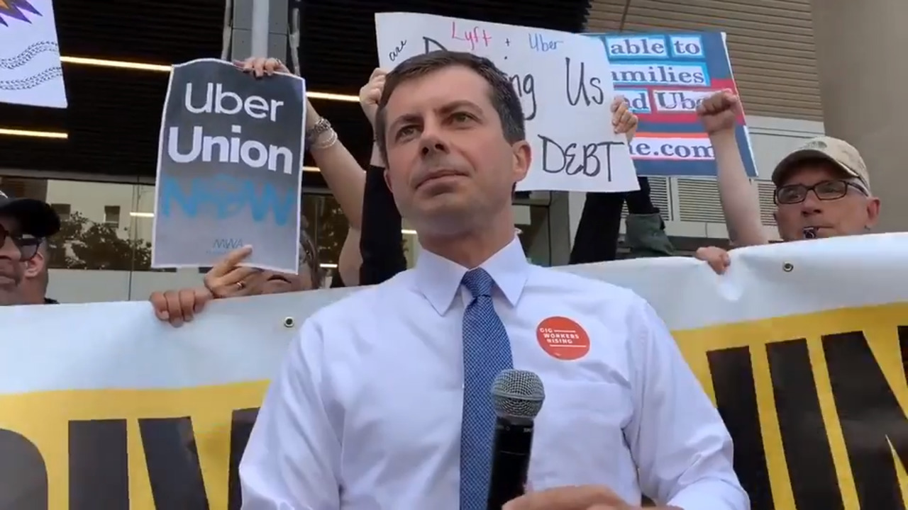 Pete Buttigieg speaks outside Uber headquarters in San Francisco to protest apps’ labor practices